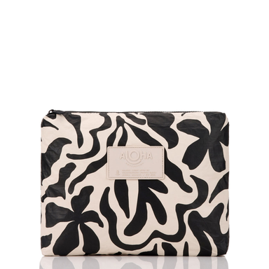 Aloha Float Mid Pouch black floral print sandstone background