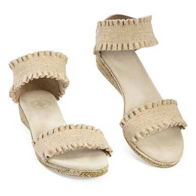 Pair of beige ruffled sandals on a white background
